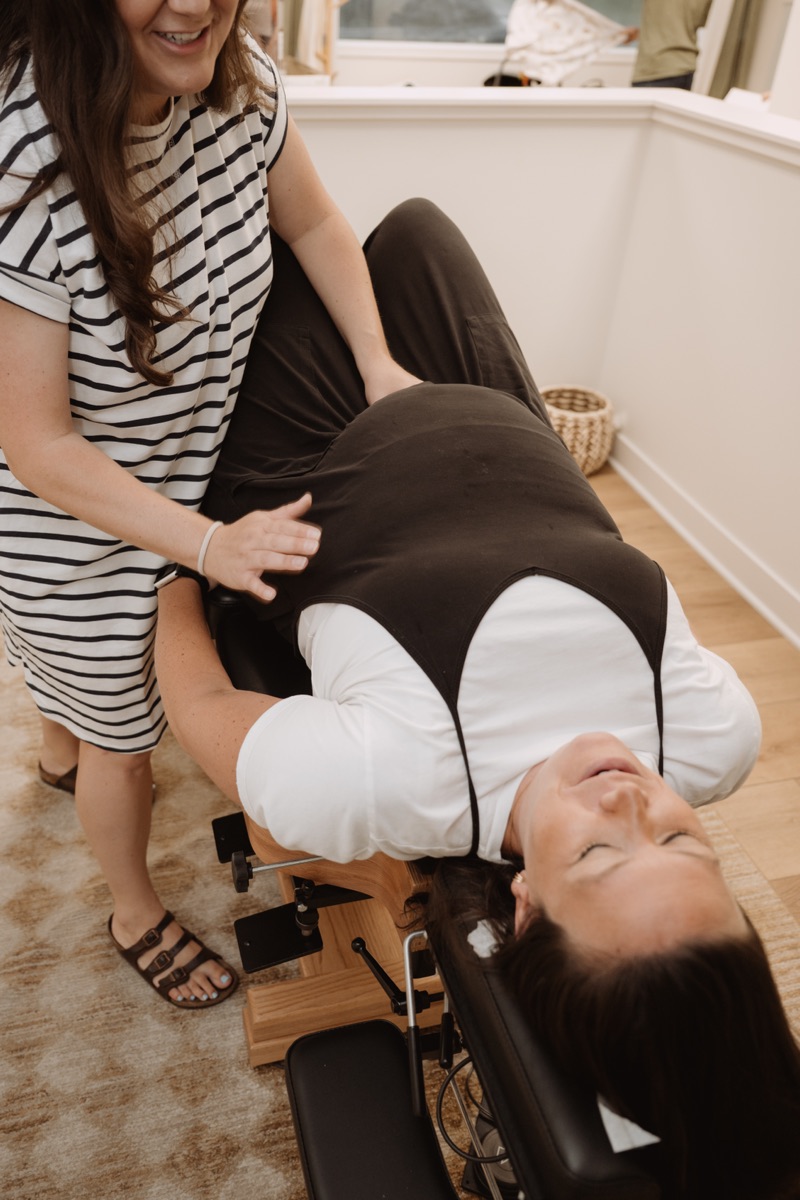 Dr. Molly Mehlman performing a prenatal chiropractic adjustment